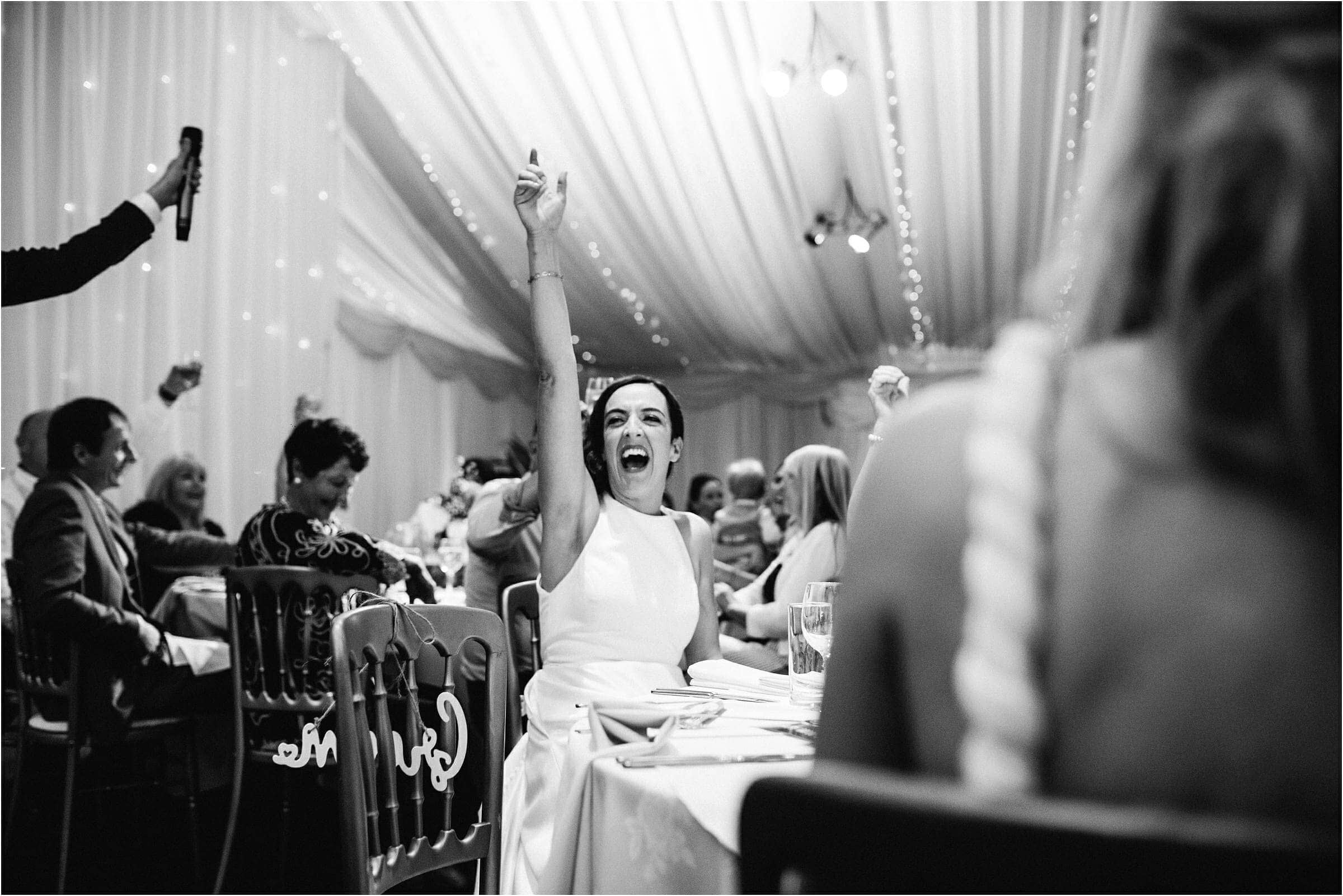 a bride cheering on her wedding day