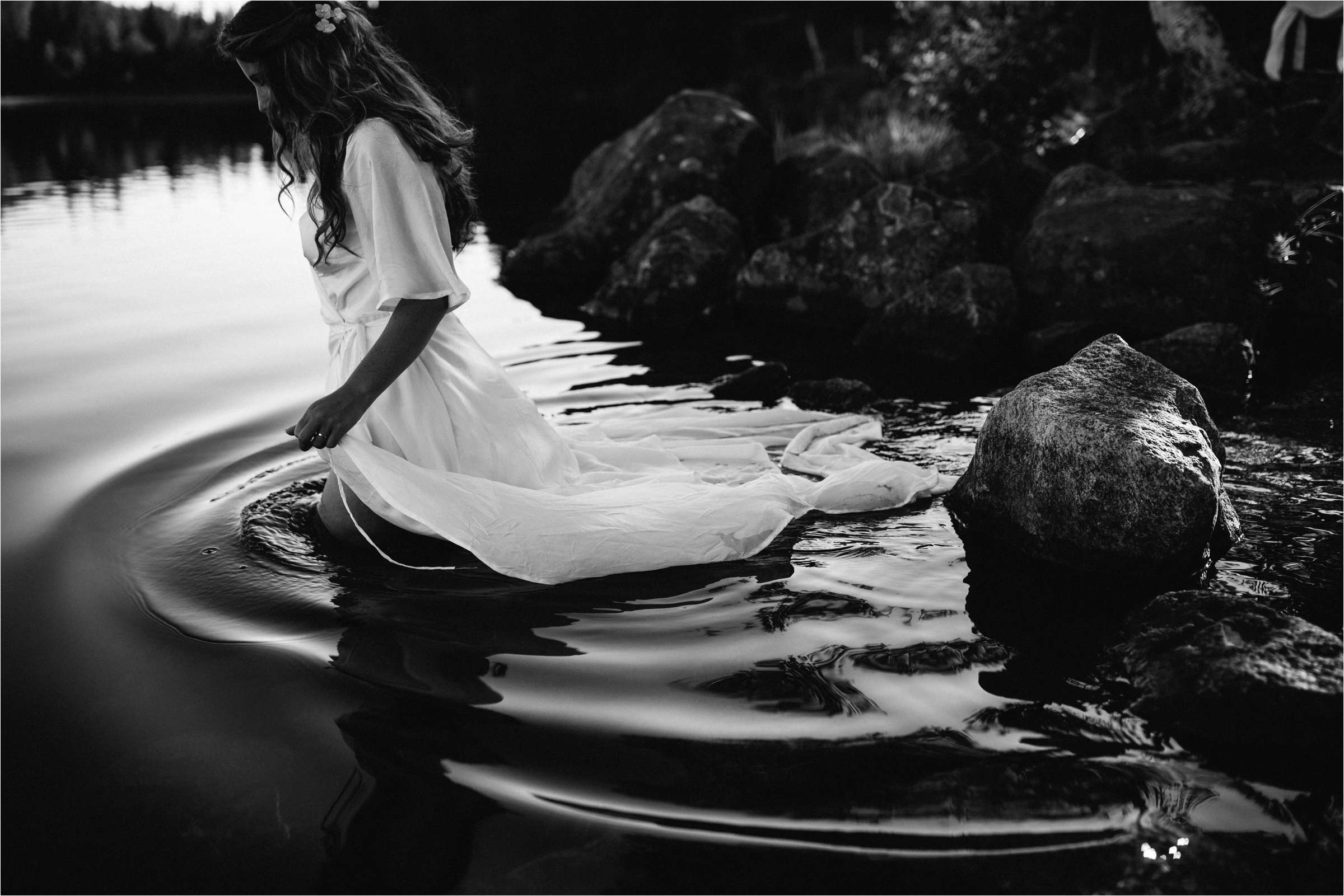 bride walking in to a lake in norway