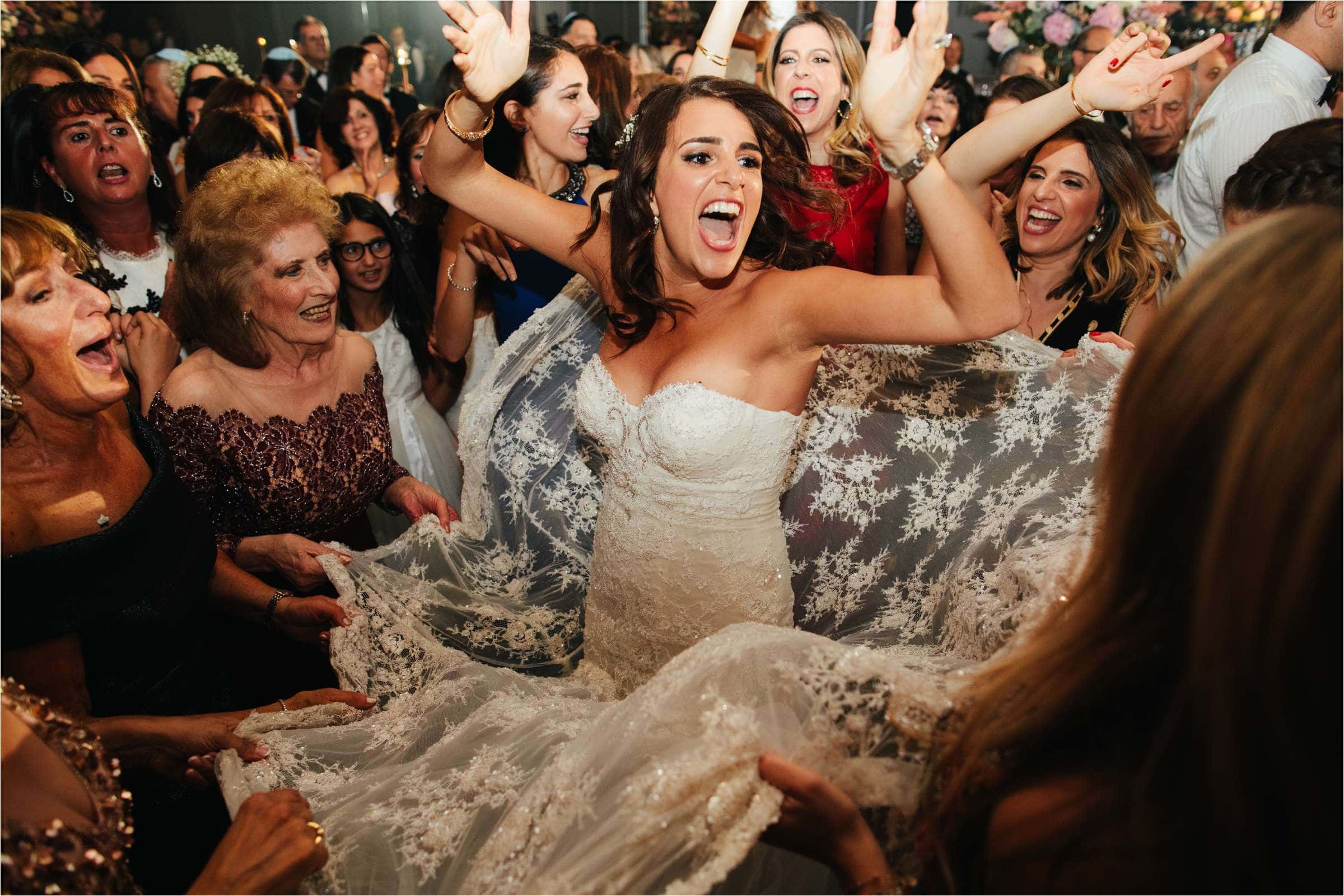 a jewish bride having fun at her London Wedding at the Savoy