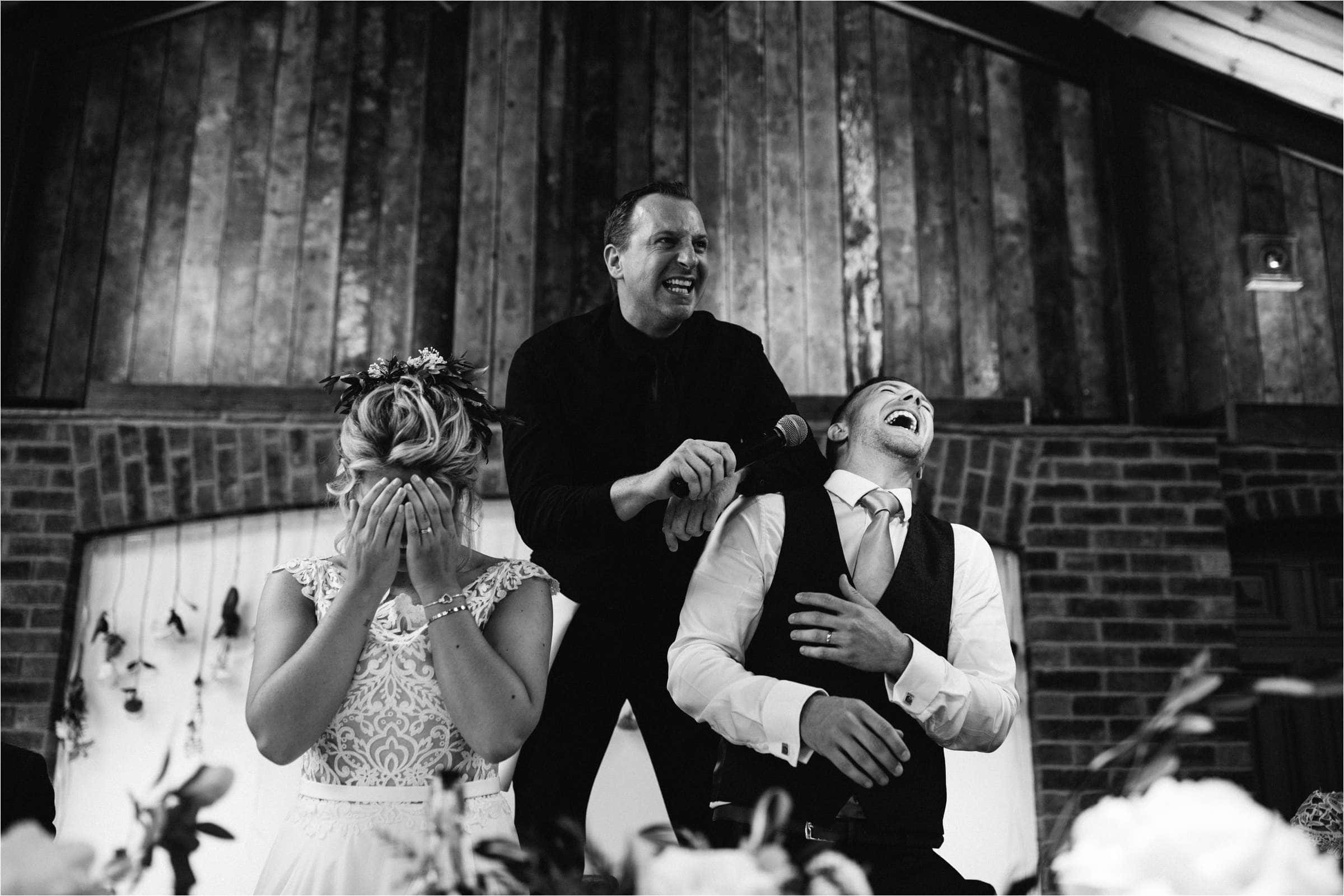 bride and groom laughing at their london wedding