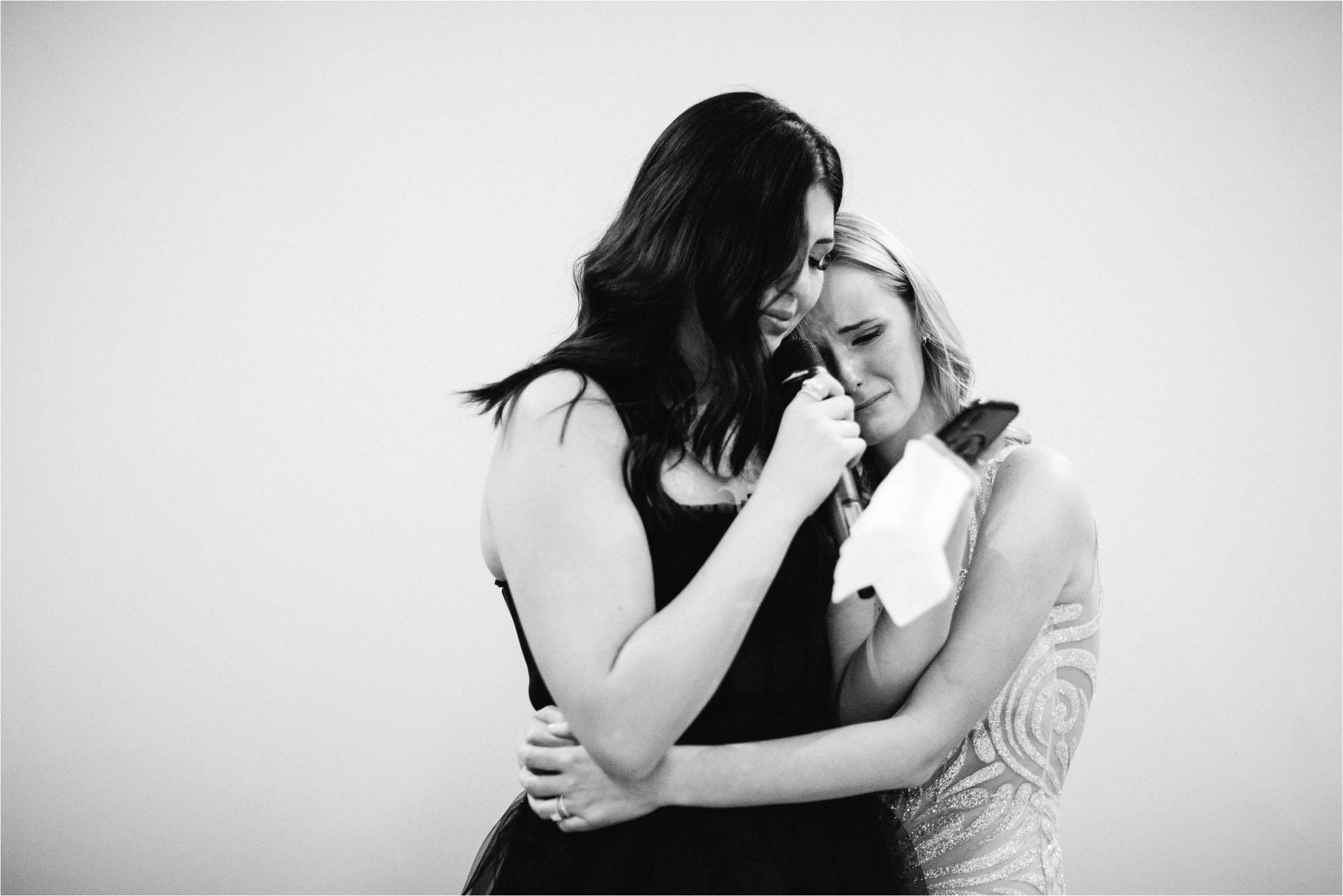 bride hugging bridesmaid at a cheshire wedding