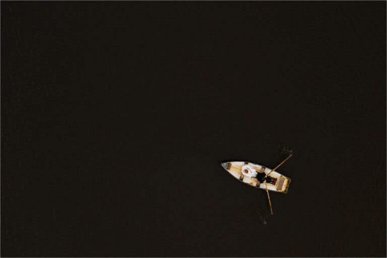 aerial photo of bride and groom on a row boat at wyresdale park