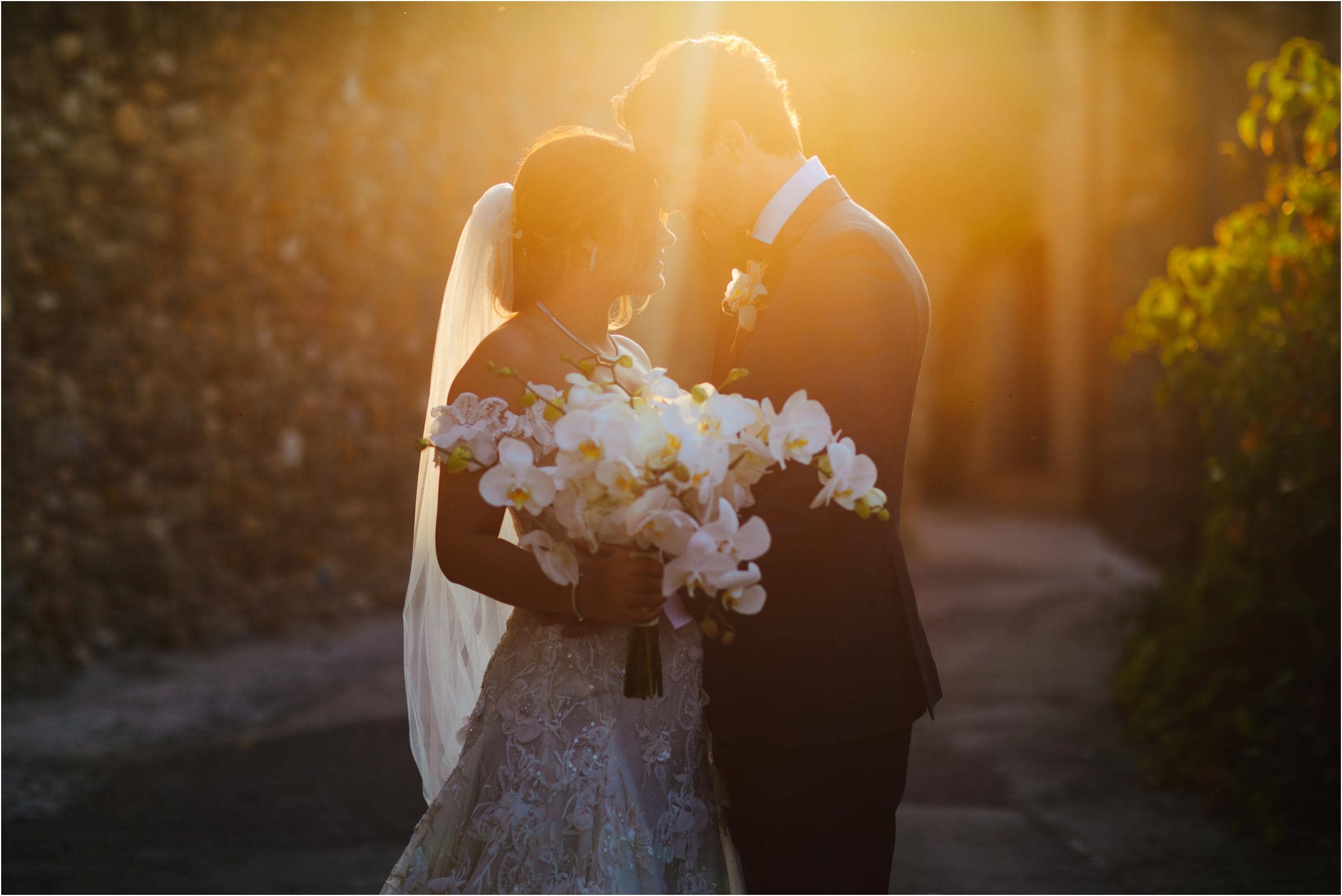 a couple kissing on their destination wedding