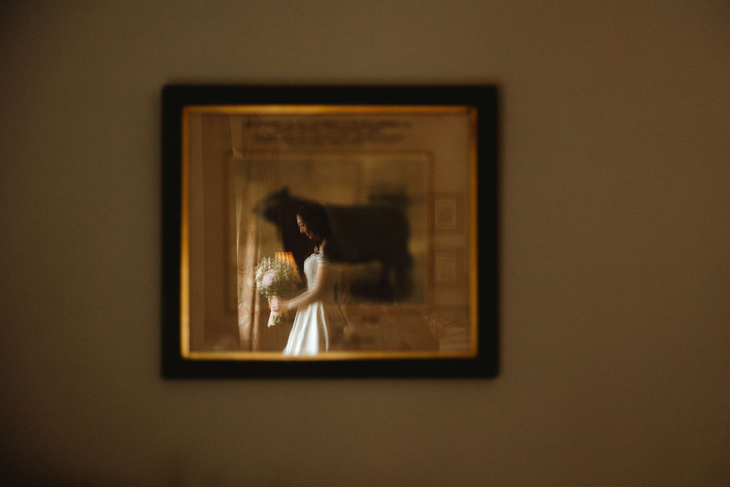 a picture of a bride reflected in a picture at a manchester wedding